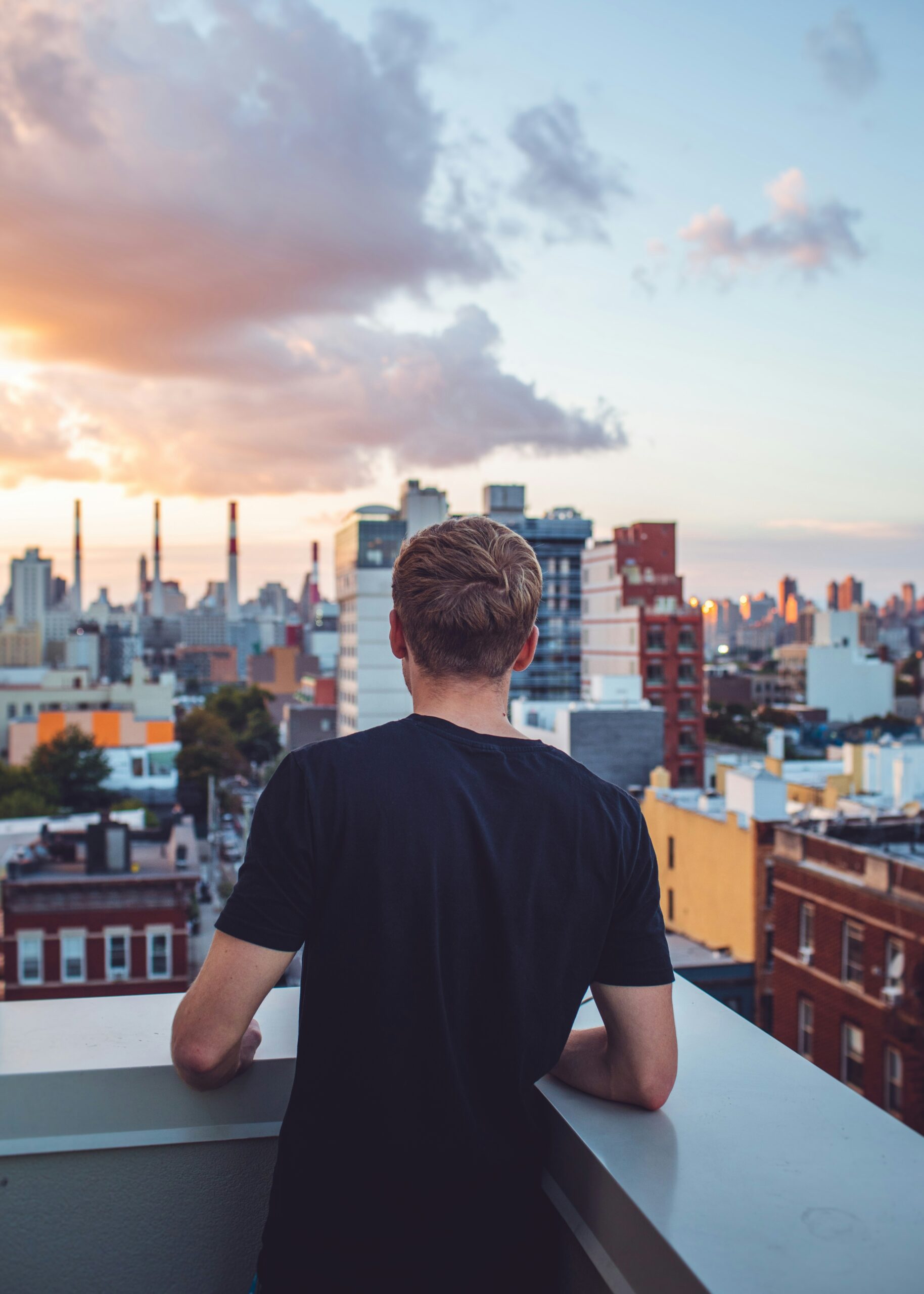 Man overlooking New York City skyline while practicing emotional resilience through somatic therapy