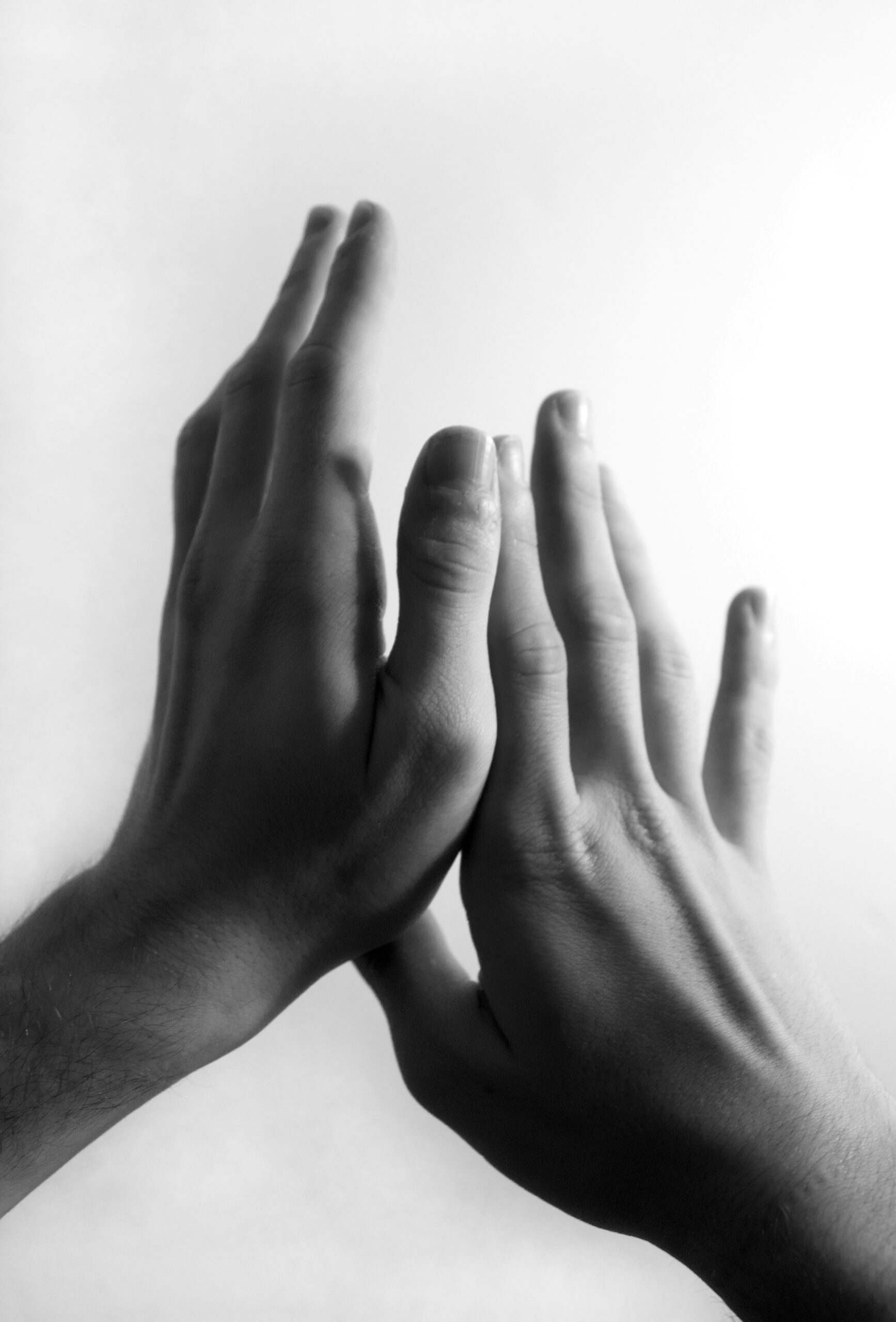 Hands gently meeting, symbolizing body awareness and nervous system regulation in somatic therapy